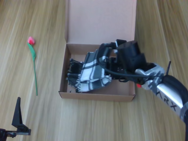 Box packing and closing, chronological frame 2 of 6 from Figure 11.