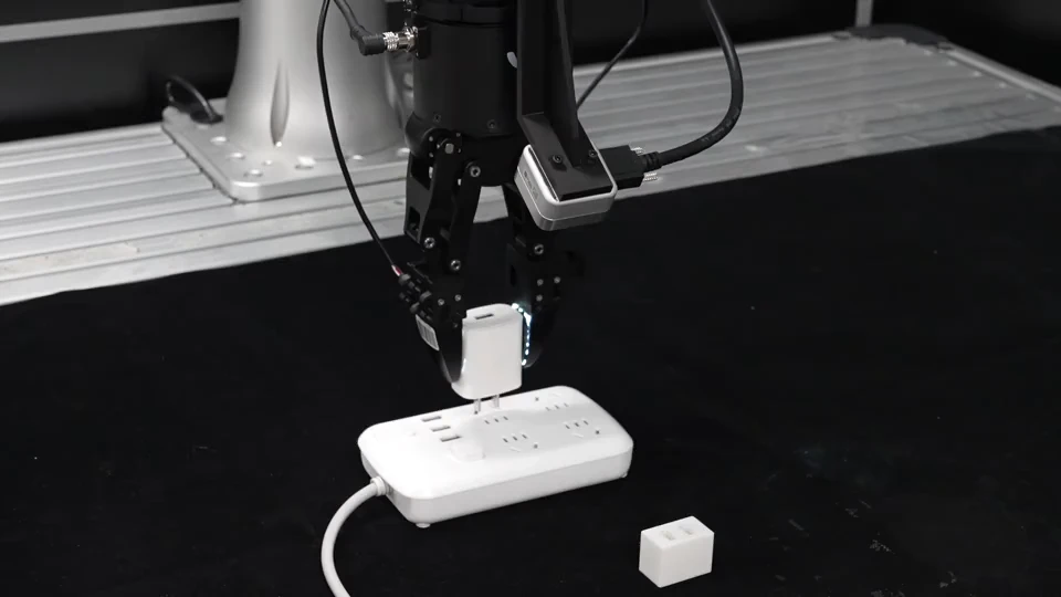 Robot inserting a charger plug into a socket