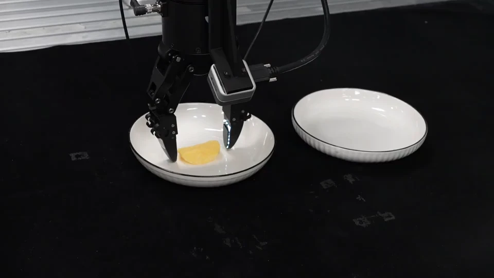 Robot gently grasping a fragile potato chip